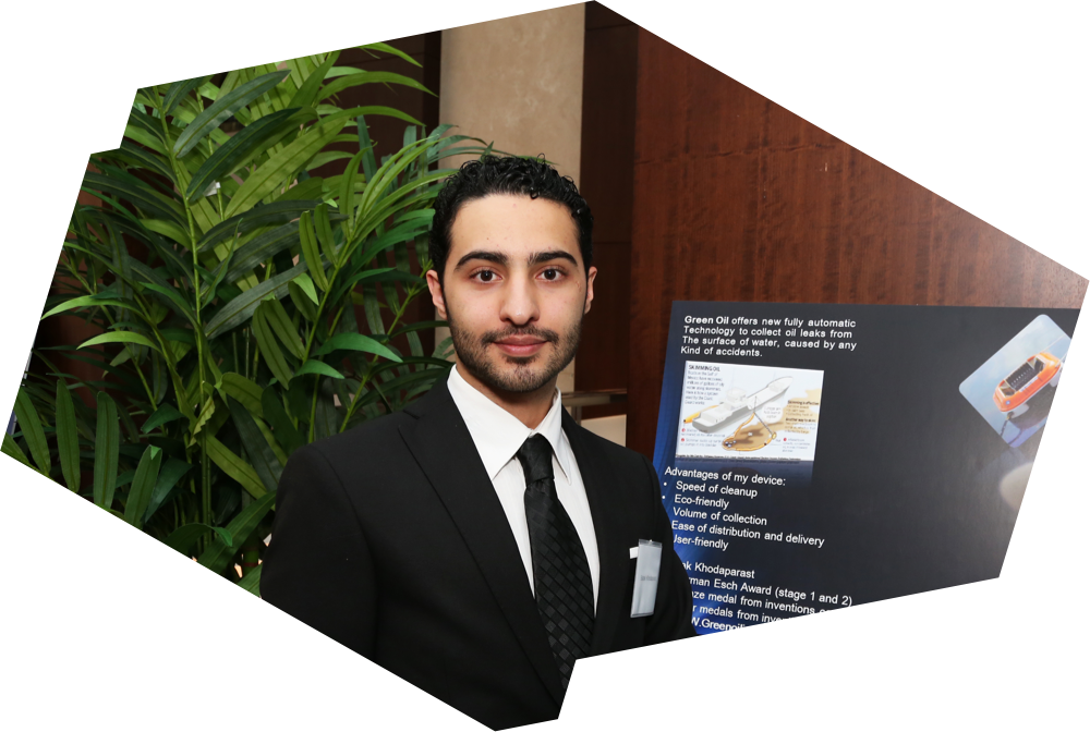 Babak Khodaparast stands in front of his poster at the Ryerson Esch Awards