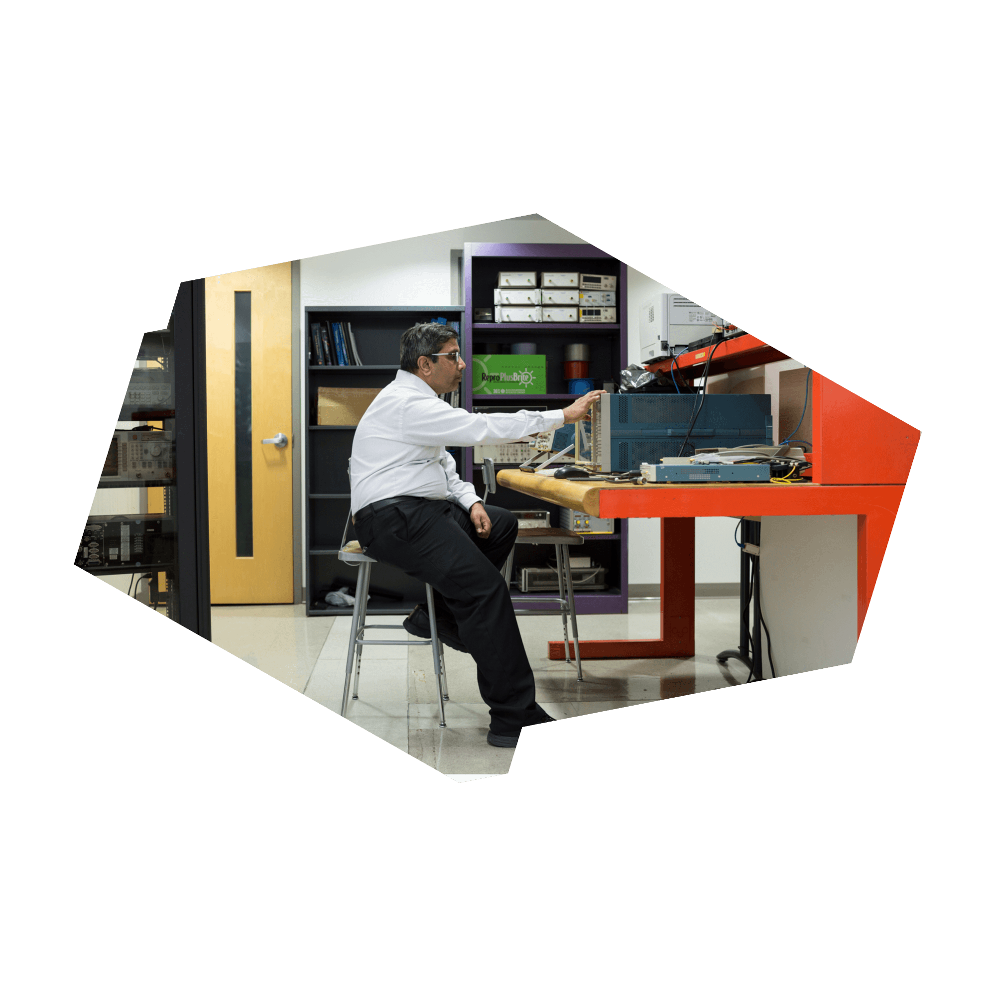 Xavier Fernando, a professor in Electrical and Computer Engineering in the Faculty of Engineering and Architectural Science, is sitting in a Ryerson lab making adjustments to equipment.