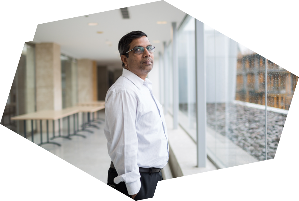 Professor Xavier Fernando stands in a corridor within the George Vari Engineering and Computing Centre.